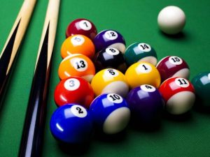 Close-up of billiards table with balls in a triangle formation