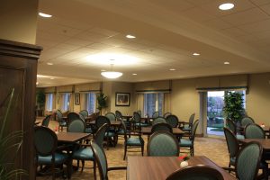 Tables and chairs in Crossings Dining Room at Oakcrossing Retirement Living