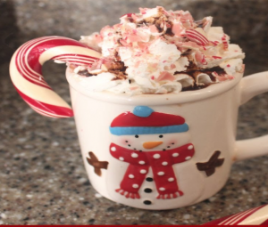 Candy cane in mug of hot chocolate