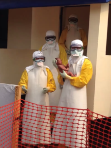 Doctors with newborn baby at an Ebola centre for pregnant women