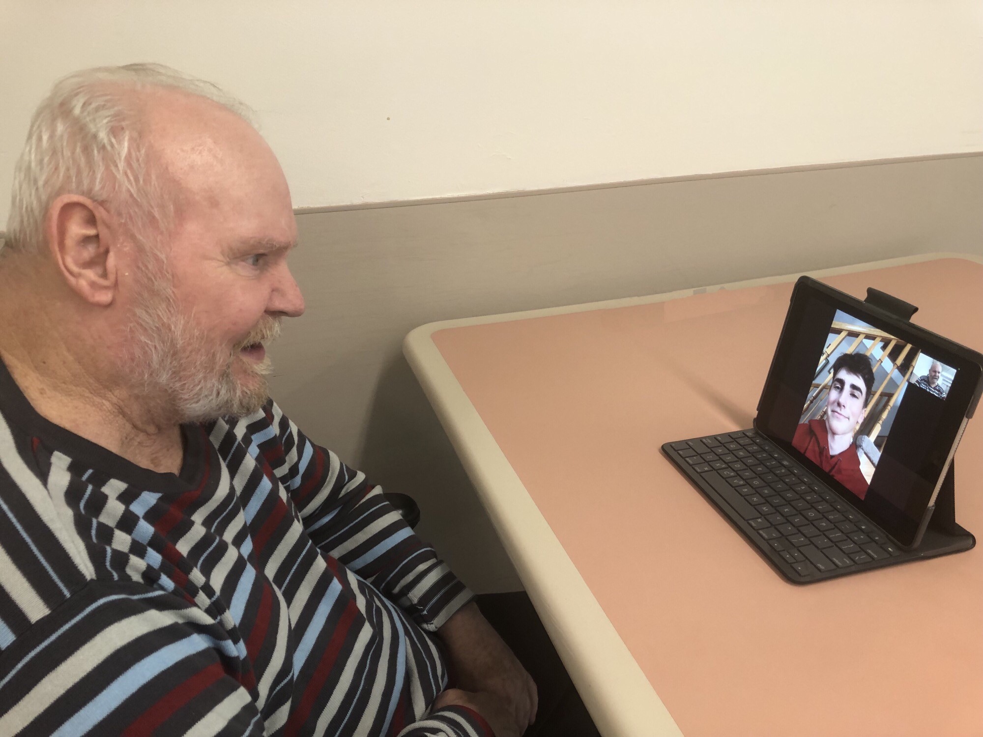 Golden Years resident Dennis on a video call with a local student