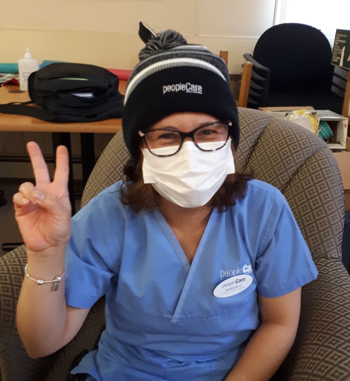 peopleCare team member giving a thumbs up