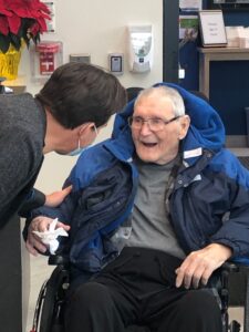 peopleCare Chairman and CEO Brent Gingerich greeting resident