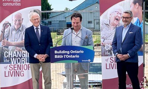 On the left is Oxford MPP Ernie Hardeman, , Brent Gingerich, CEO of peopleCare is in the middle, and and on the right is Paul Calandra, Minister of Municipal Affairs and Housing. Brent is speaking at the podium