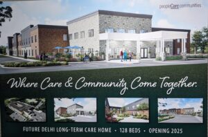 A sign that reads "where care and community come together"