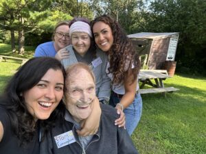 Smiling group of residents and staff